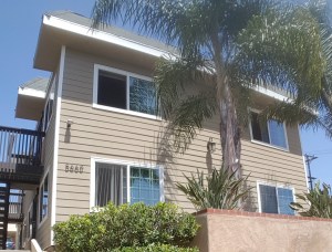 When I lived here the entire building was covered in old, molsy cedar shingles that gave it a much more run down, crack house look